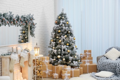 Photo of Decorated Christmas tree in modern living room interior