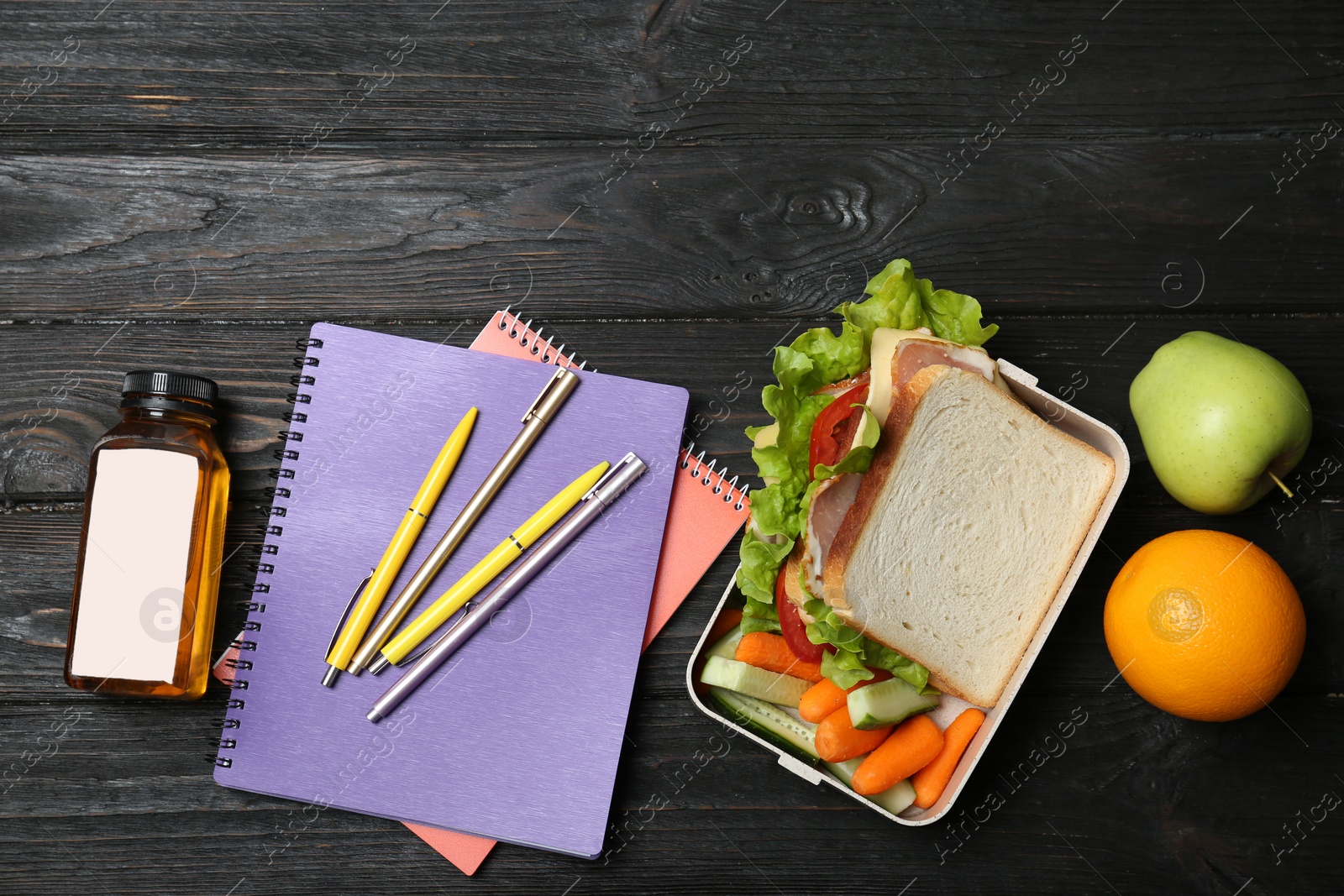 Photo of Flat lay composition with healthy food for school child on wooden background