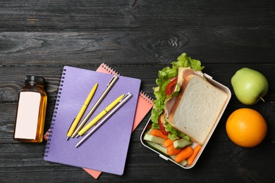 Flat lay composition with healthy food for school child on wooden background