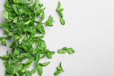 Photo of Fresh aromatic mint on light background, top view