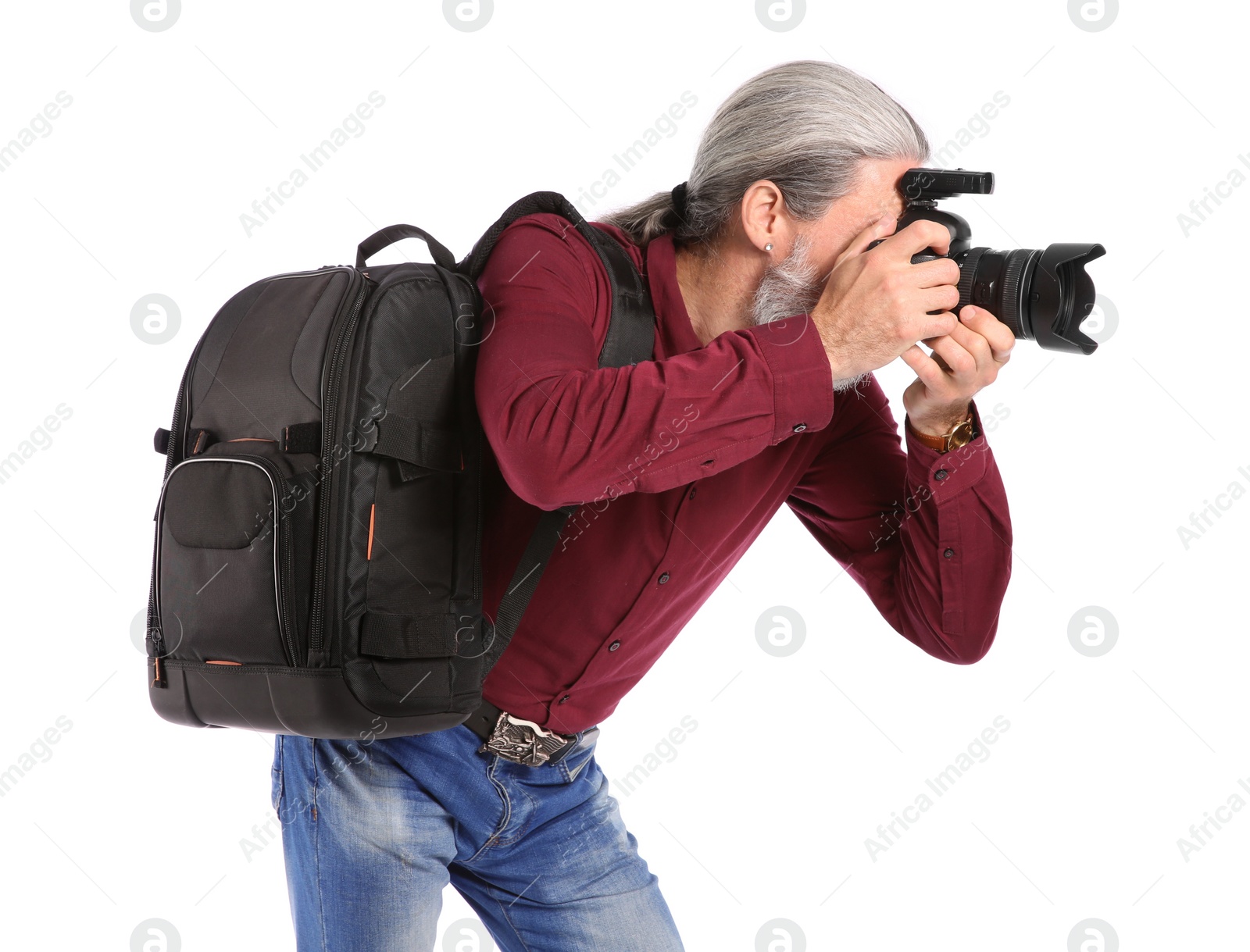 Photo of Male photographer with professional camera on white background