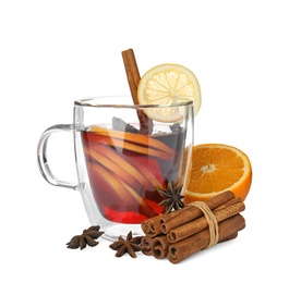 Glass cup of mulled wine, fresh orange, cinnamon sticks and lemon isolated on white