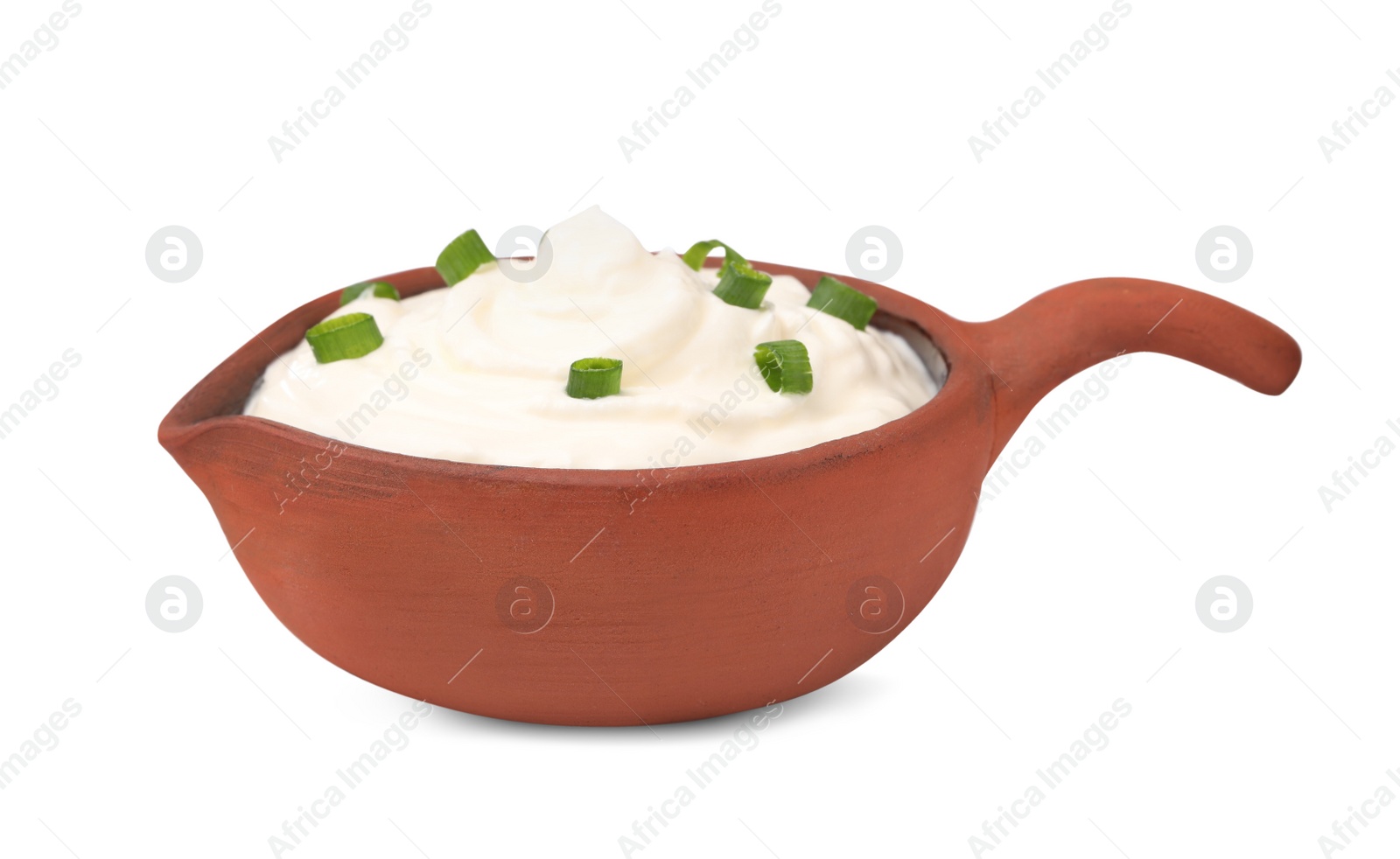 Photo of Delicious sour cream with chives in sauce boat on white background