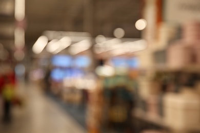 Photo of Blurred view of modern shopping mall interior