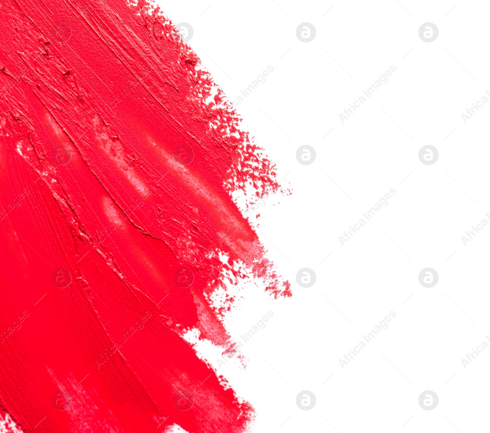 Photo of Red lipstick smears on white background, top view. Space for text