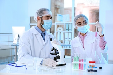 Young scientists working in laboratory. Chemical analysis