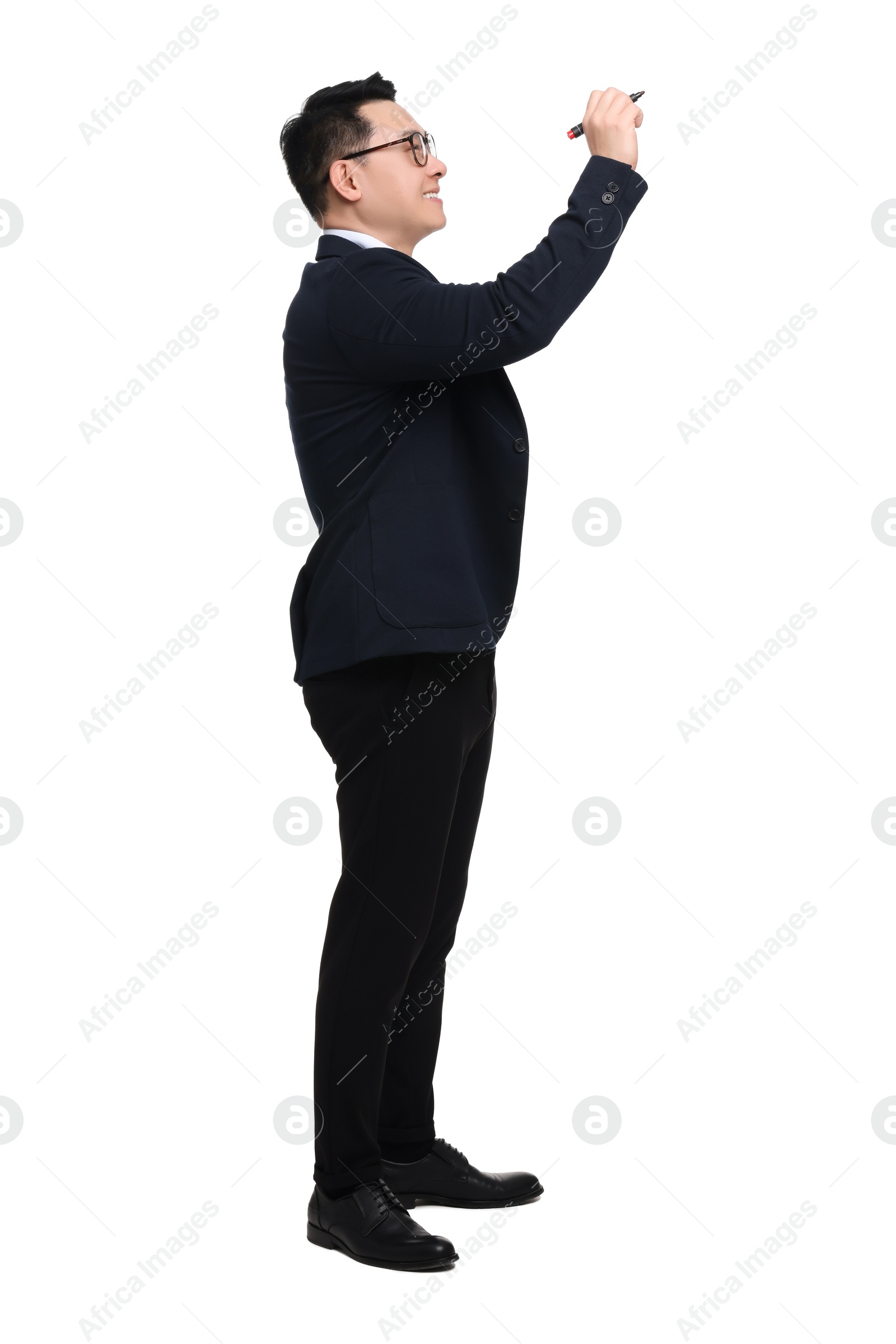 Photo of Businessman in suit with marker writing on white background