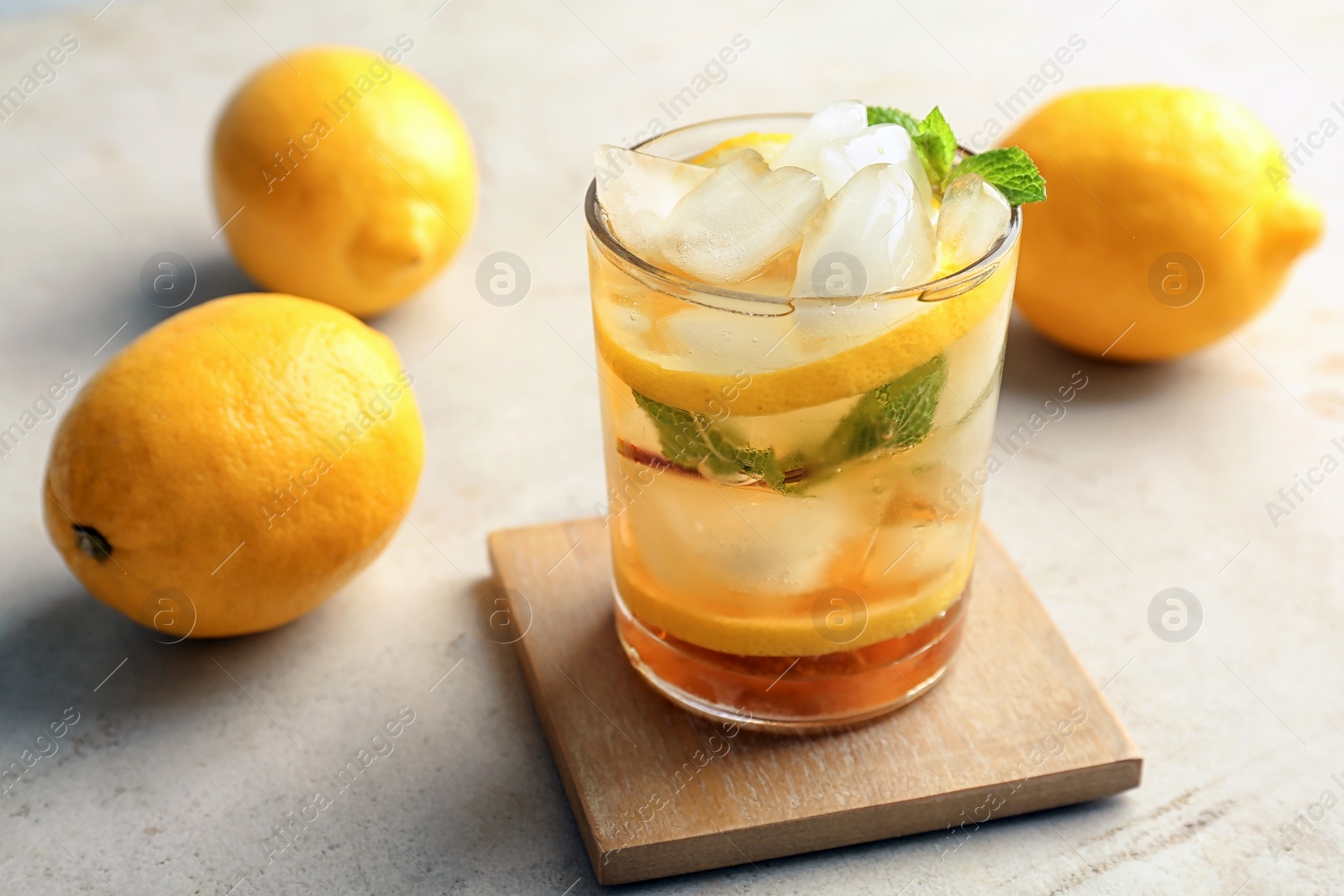 Photo of Glass of delicious mint julep cocktail on table