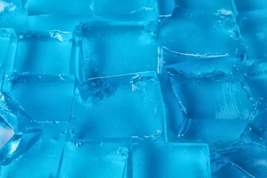 Blue jelly cubes as background, closeup view