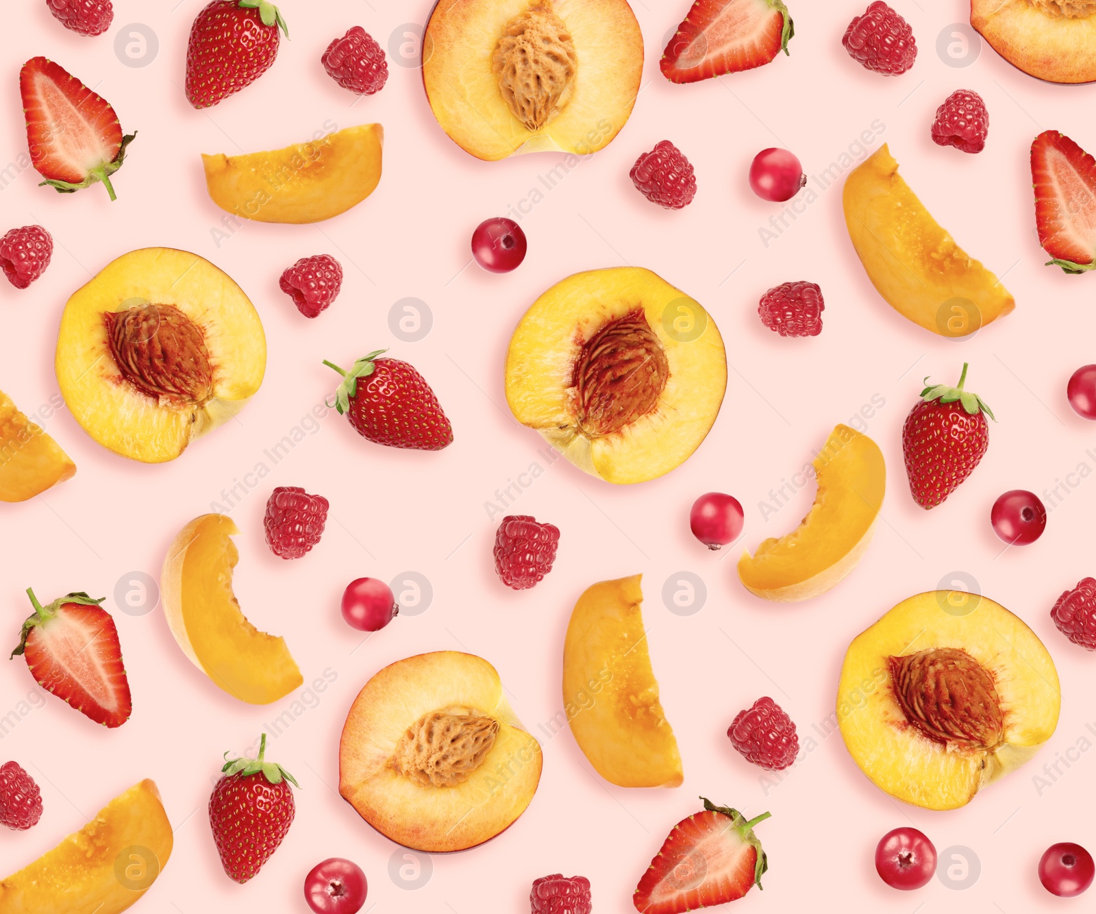 Image of Layout with peaches, strawberries, cranberries and raspberries on pale pink background, top view