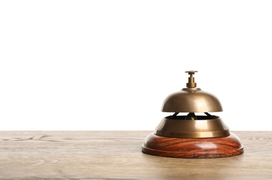 Hotel service bell on wooden table against white background