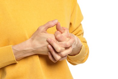 Woman cracking her knuckles on white background, closeup. Bad habit