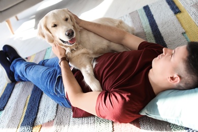 Photo of Portrait of owner with his friendly dog at home