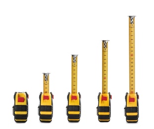 Set with measuring tapes on white background