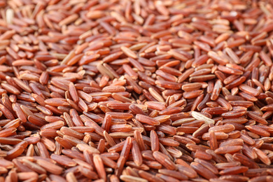 Photo of Closeup view of brown rice as background