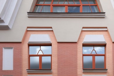 Wall of vintage building with beautiful windows