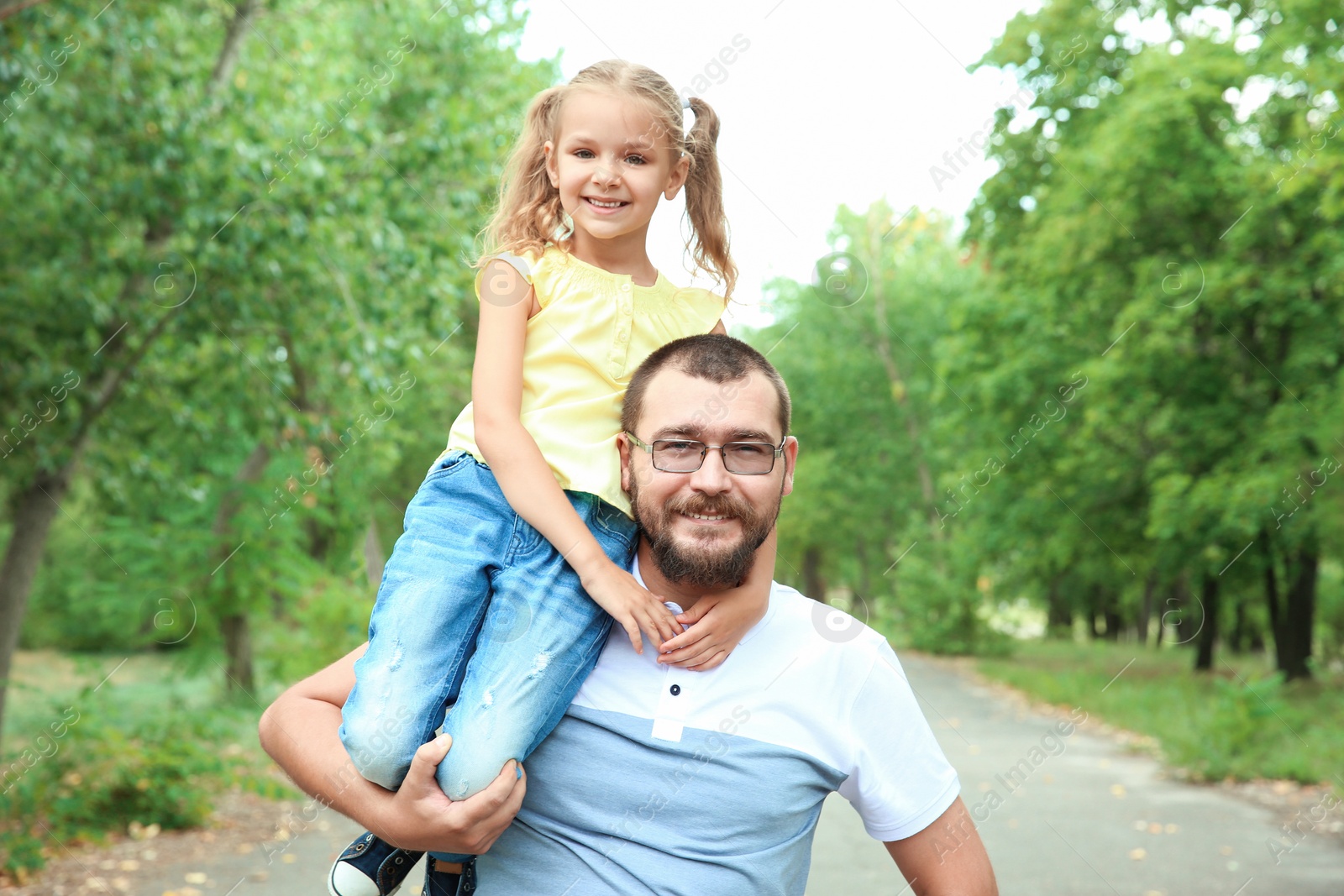 Photo of Father with his child outdoors. Happy family