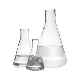 Photo of Flasks with transparent liquid on white background