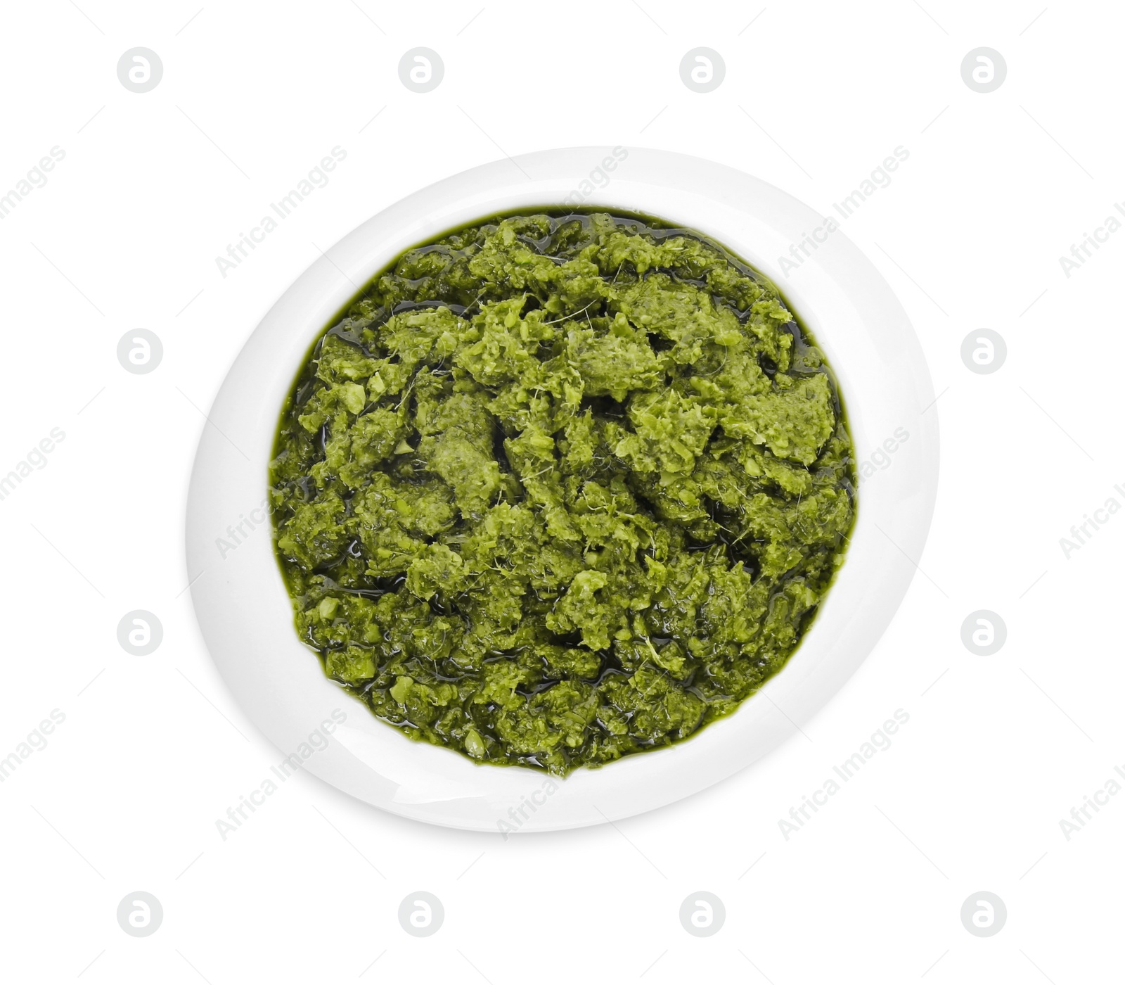 Photo of Delicious pesto sauce in bowl isolated on white, top view