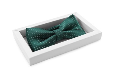 Photo of Stylish green bow tie with polka dot pattern on white background