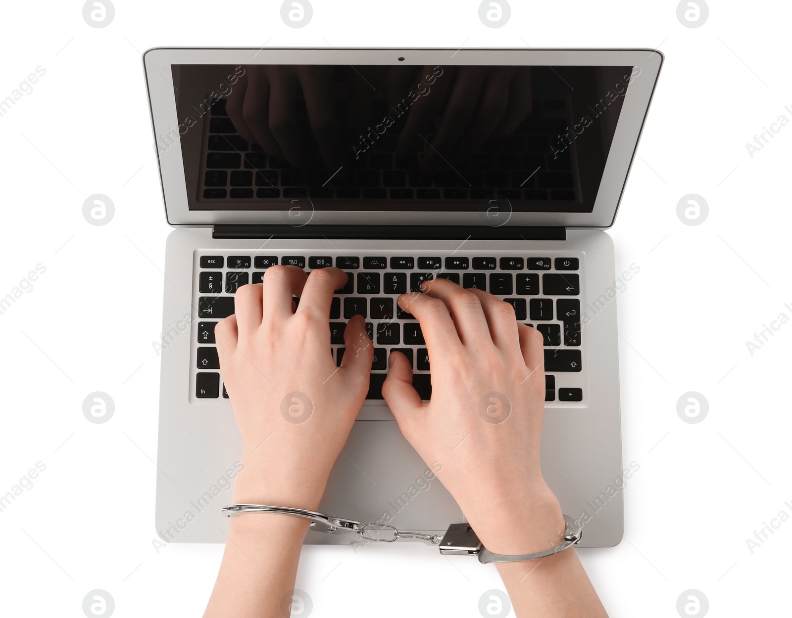Photo of Woman in handcuffs typing on laptop against white background, top view. Internet addiction