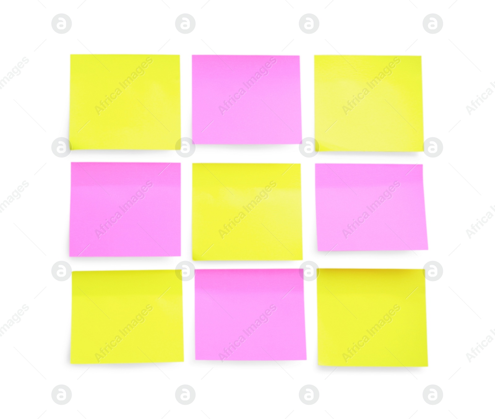 Photo of Blank yellow and pink sticky notes on white background, top view. Space for text