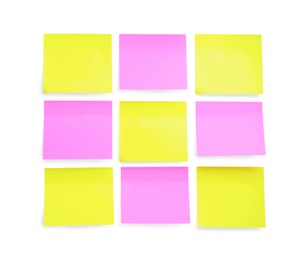 Blank yellow and pink sticky notes on white background, top view. Space for text