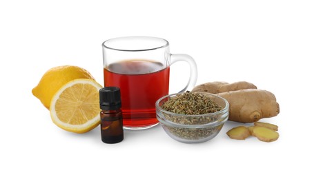 Photo of Cup of tea and different natural cold remedies on white background. Cough treatment