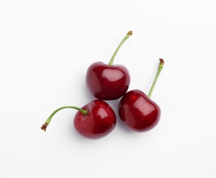 Ripe sweet cherries on white background, top view