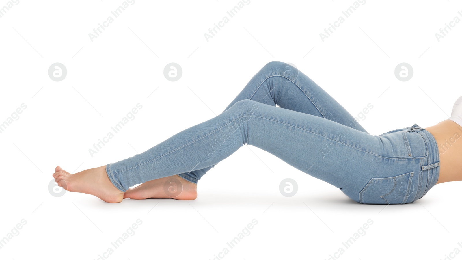 Photo of Woman wearing stylish light blue jeans on white background, closeup