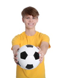 Teenage boy with soccer ball on white background