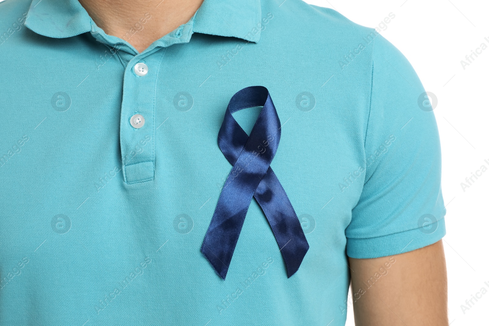 Photo of Man with blue ribbon on white background, closeup. Urology cancer awareness