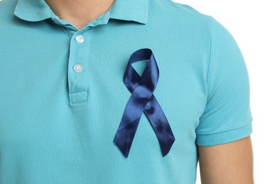 Photo of Man with blue ribbon on white background, closeup. Urology cancer awareness