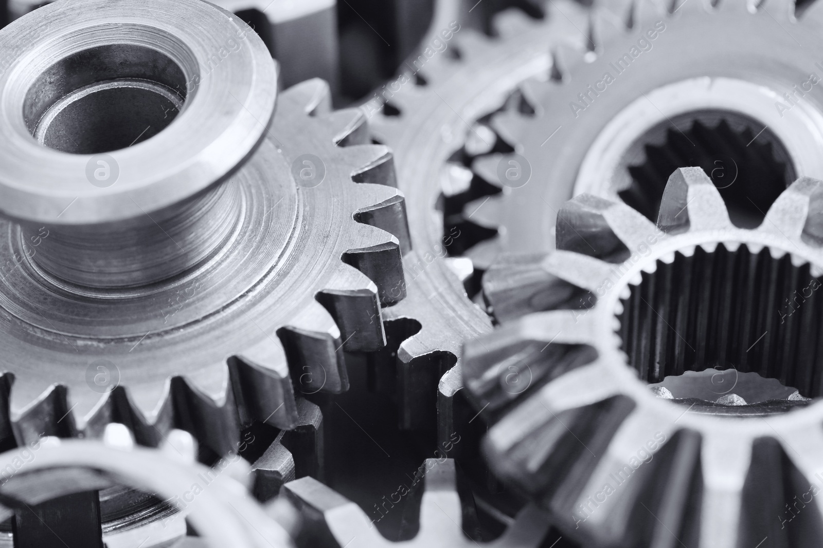 Photo of Many different stainless steel gears as background, closeup