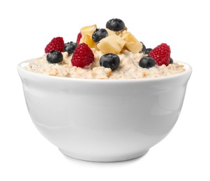 Photo of Tasty boiled oatmeal with berries and banana in bowl isolated on white