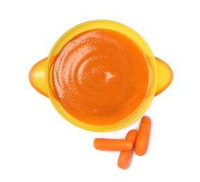 Photo of Delicious baby food in bowl and fresh carrots isolated on white, top view