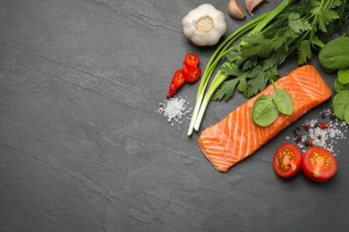 Photo of Fresh salmon and ingredients for marinade on black table, flat lay. Space for text