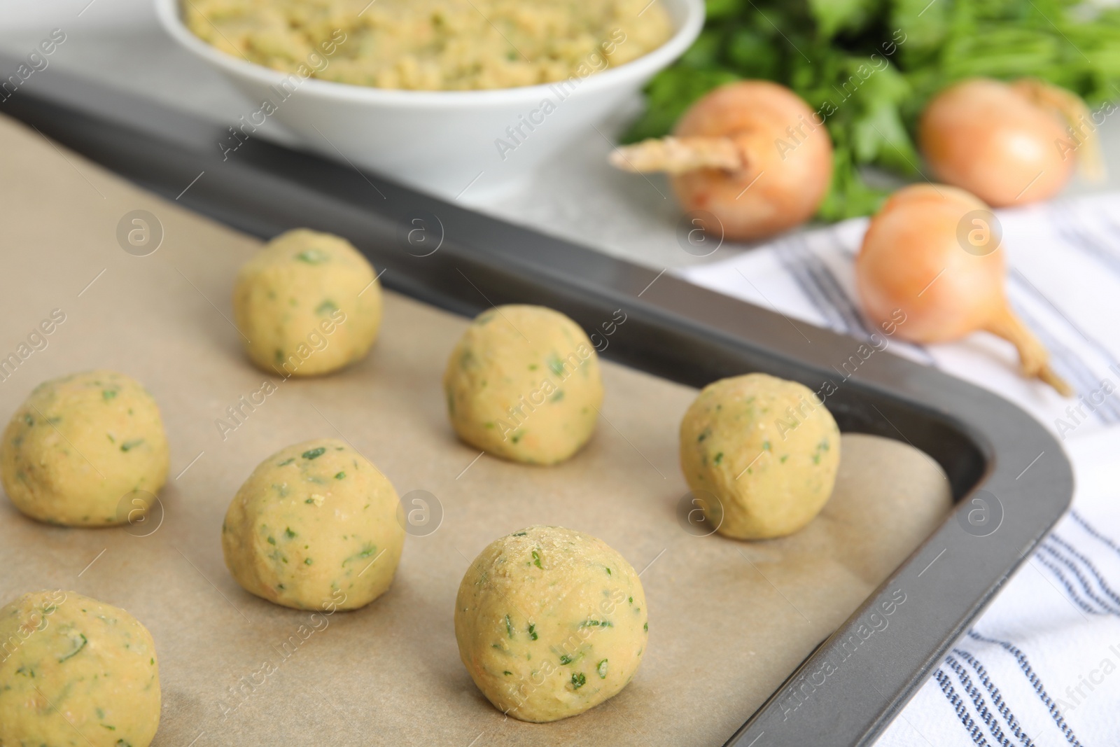 Photo of Raw falafel balls on baking sheet, closeup