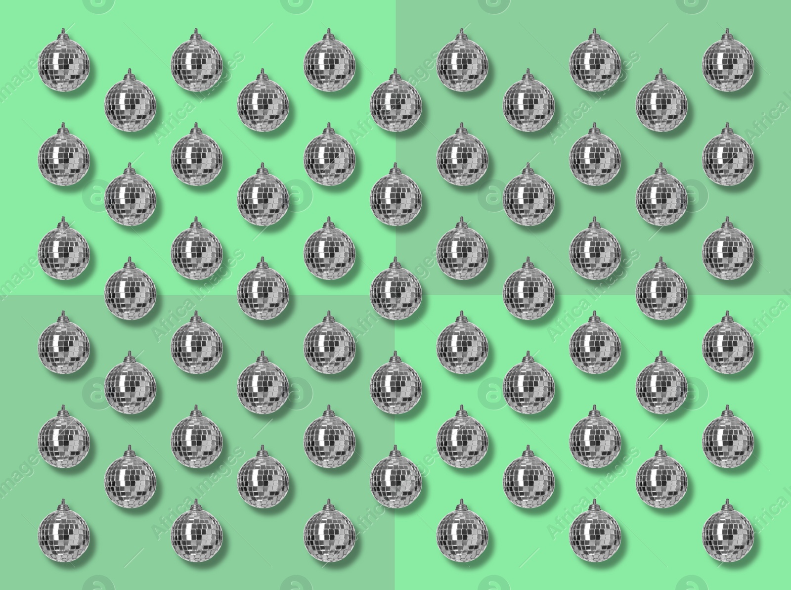 Image of Many shiny disco balls on green background, flat lay