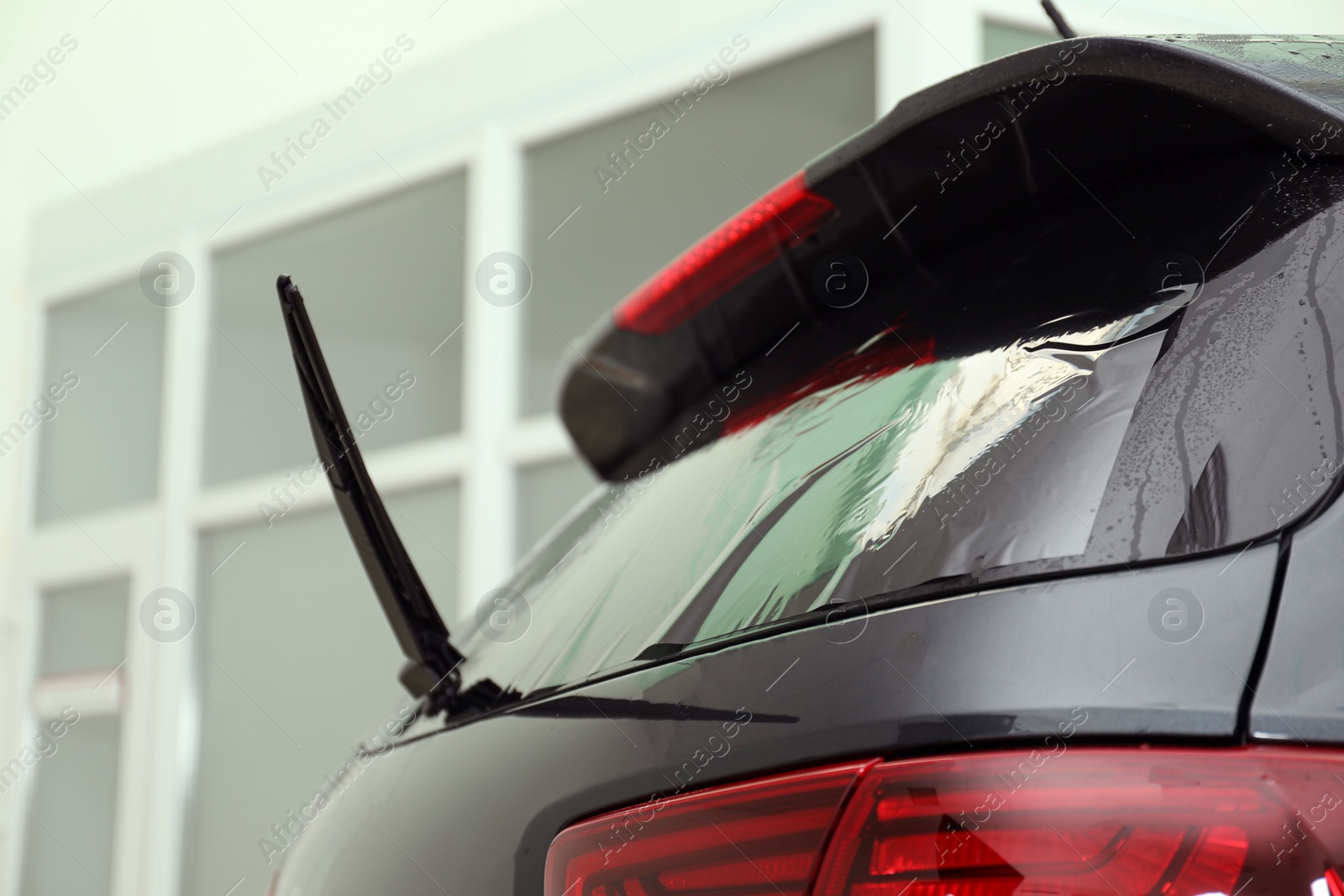 Photo of Car window covered with tinting foil, closeup