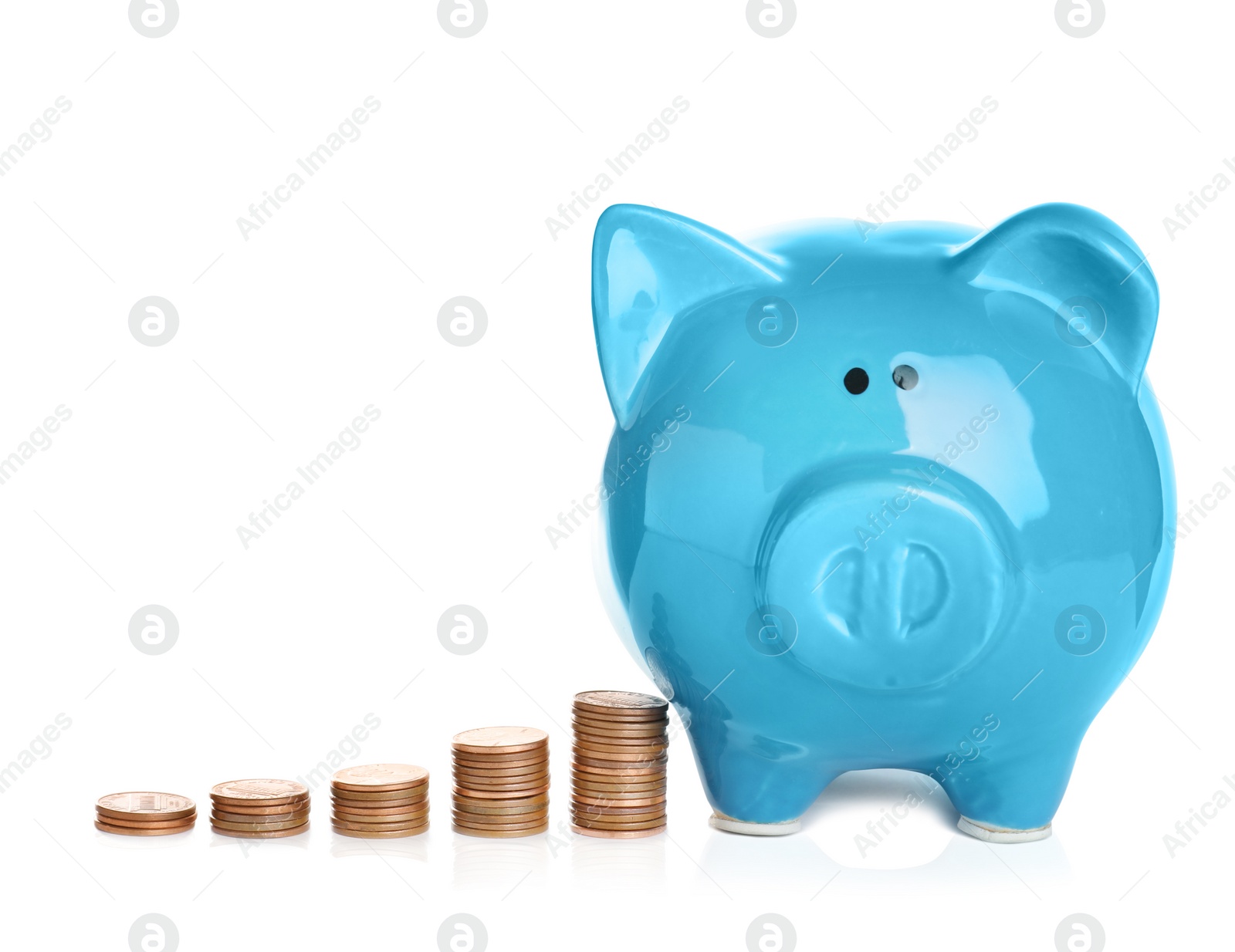 Photo of Ceramic piggy bank and many coins on white background