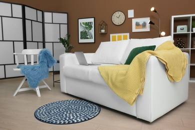 Photo of Stylish living room interior with comfortable sofa