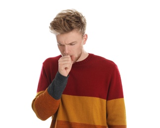 Handsome young man coughing against white background