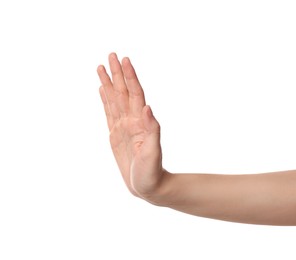 Woman showing stop gesture on white background, closeup