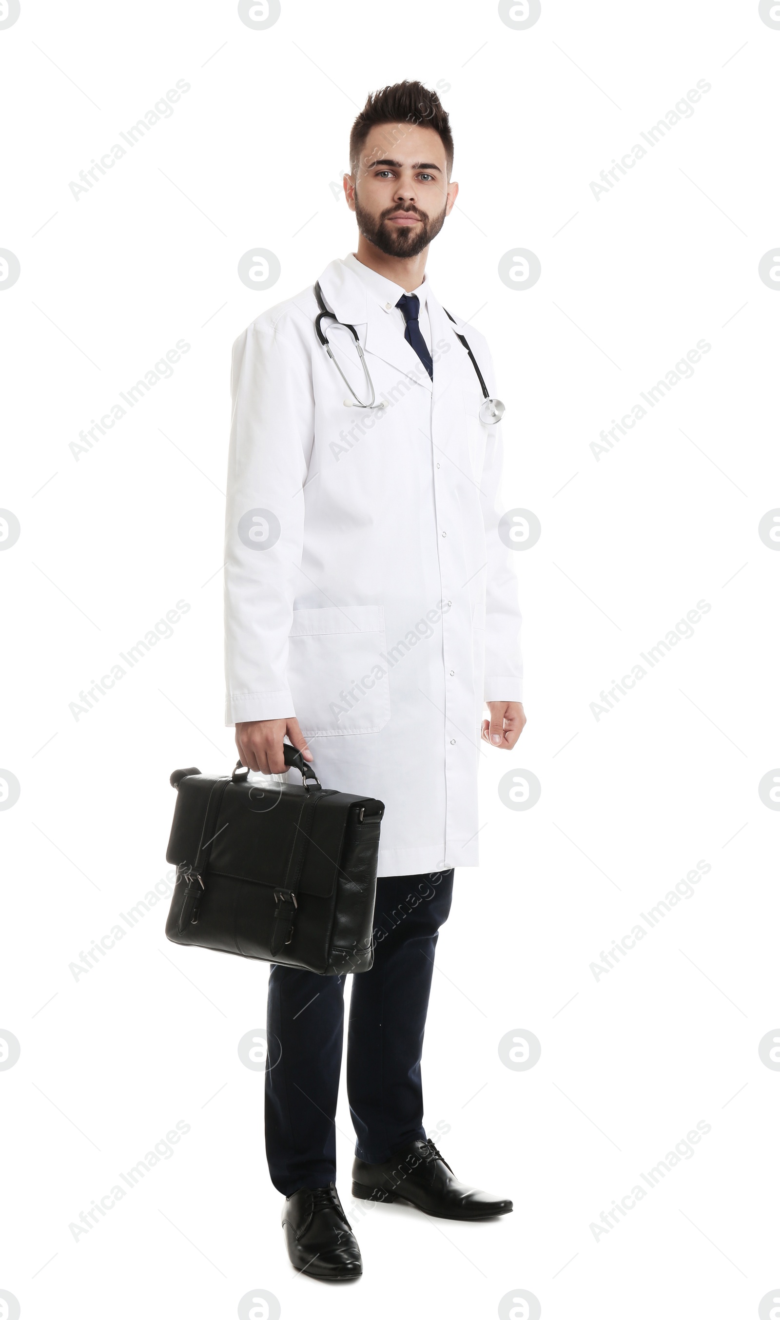 Photo of Young male doctor in uniform with bag isolated on white