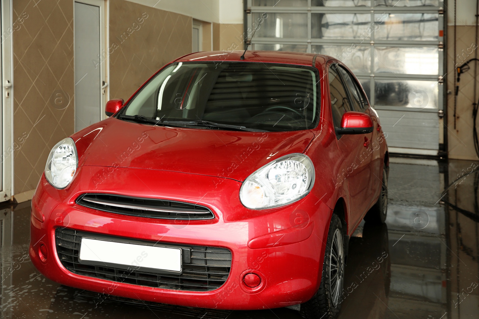 Photo of Modern automobile at professional car wash service