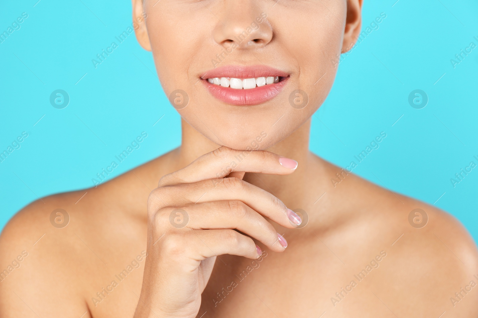 Photo of Closeup view of beautiful young woman on color background. Lips contouring, skin care and cosmetic surgery concept