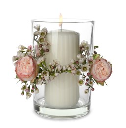 Photo of Glass holder with burning candle and floral decor isolated on white