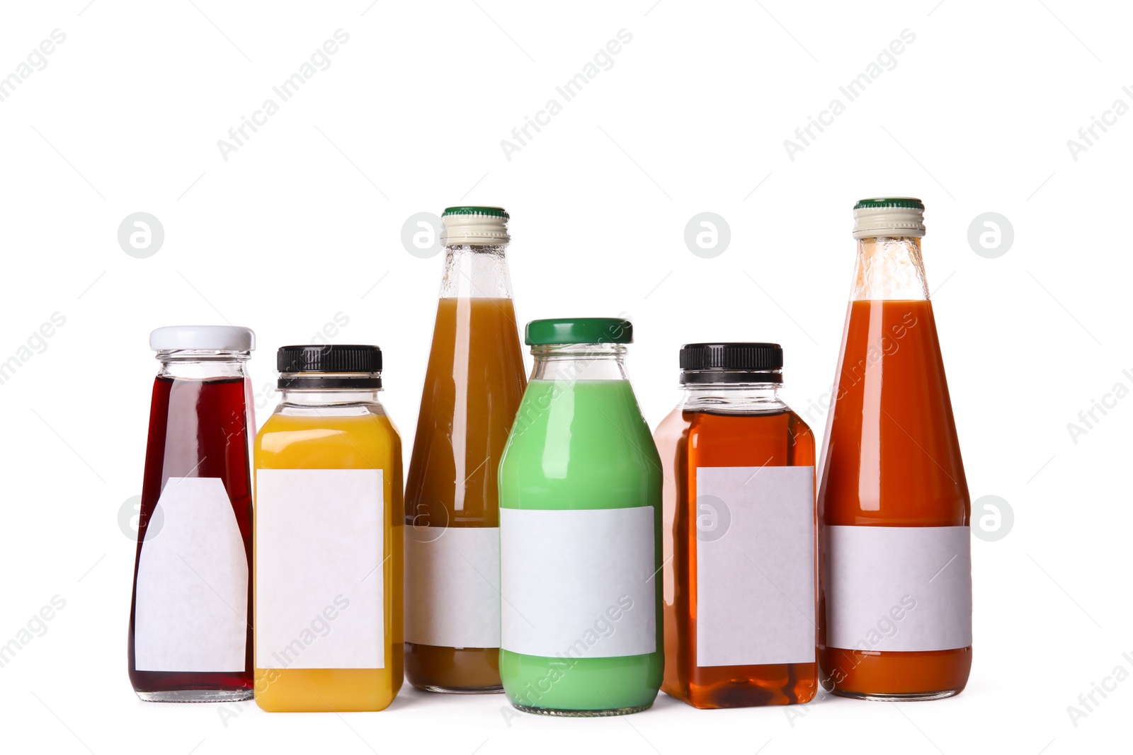 Photo of Tasty drinks in bottles with blank labels on white background. Mock up for design