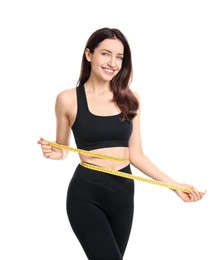 Photo of Happy young woman with measuring tape showing her slim body against white background